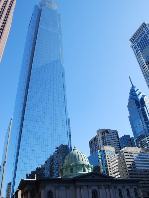 Comcast towers over a church